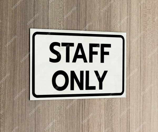 warning-silver-stainless-steel-sign-with-character-black-message-staff-only-front-wooden-door_281691-3